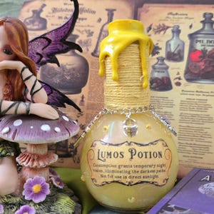 Lumos Potion decorative bottle, mystic, magical, light, yellow, displays.