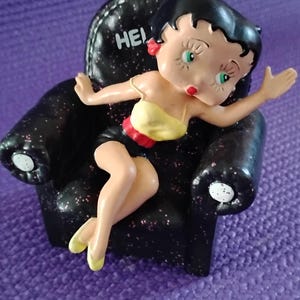 Betty Boop sitting in a chair, collectible figurine