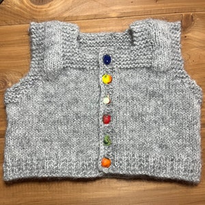 Handknit baby vest with fruit & veggie buttons