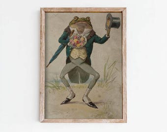 Puede incluir: Una impresión vintage enmarcada presenta una rana elegante con abrigo verde, pantalones grises y sombrero de copa, sosteniendo un ramo y un paraguas. La obra de arte tiene una estética caprichosa y antigua, con el texto "FOXGLOVE WALL ART" en la parte inferior.