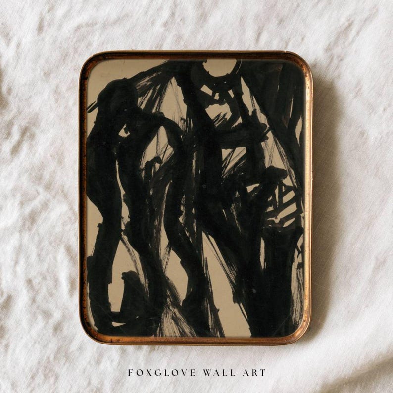 May include: Abstract black ink painting on a rectangular tray with a gold-colored frame. The artwork features bold brushstrokes and the text "FOXGLOVE WALL ART" at the bottom.