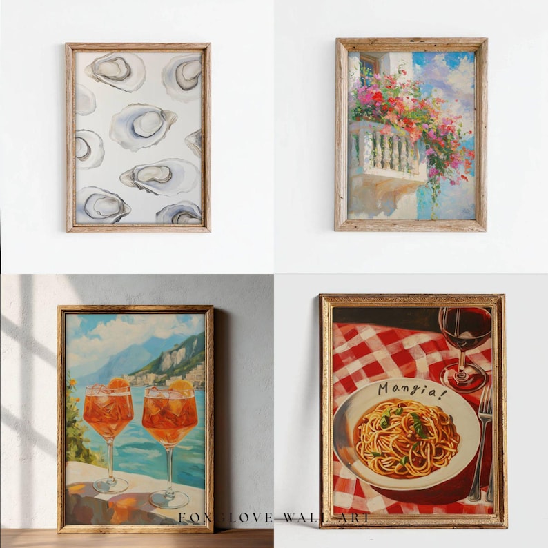 May include: Four framed art prints. One shows oyster shells on a white background. Another depicts a balcony with vibrant flowers. The third shows two cocktails with a coastal view. The last shows pasta with the word "Mangia!"