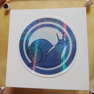 Logo STEELCLASH : escargot bleu