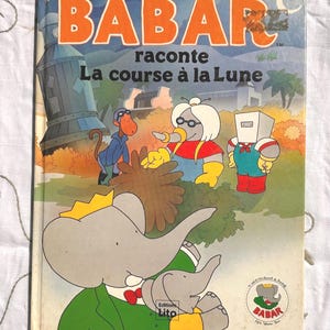 BABAR narra la carrera hacia la Luna Libro Vintage - Ediciones LITO - 1990 - Personajes de Babar - Creado por Jean y Laurent de Brunhoff