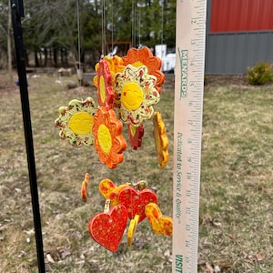 Whimsical charming handcrafted ceramic wind chime for a garden, patio, porch, or deck.  Soothing tinkling sound with the breeze. Great gift!