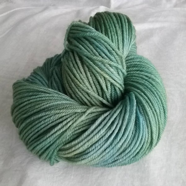 Tide Pool (PRE-ORDER), green-blue tonal hand-dyed superwash merino worsted wool yarn.