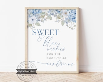 May include: A framed print with the words "SWEET & blue wishes" in blue script, with floral accents of blue and white hydrangeas. The text "FOR THE SOON-TO-BE mr & mrs" is also included. A digital download.