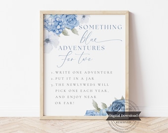 May include: Framed print with the text "Something Blue Adventures for Two." The print features blue floral accents and instructions for a wedding activity. The wooden frame adds a rustic touch.