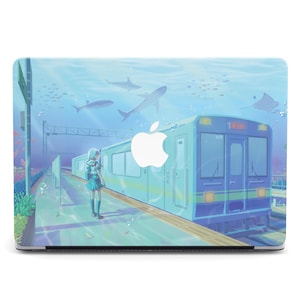 May include: A laptop skin featuring an anime-style illustration of a train station underwater. The design includes a train, sharks, and a girl standing on the platform, all in shades of blue and green. An Apple logo is visible.