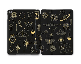 May include: Black tablet case with a gold celestial design. The case features illustrations of the sun, moon, stars, owl, butterfly, hands, and other mystical symbols. The case is open, revealing the interior.