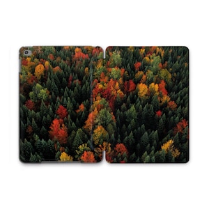 May include: A tablet case featuring a vibrant forest scene. The design showcases a dense canopy of trees in shades of green, red, orange, and yellow, creating a colorful autumn landscape. The case is designed to protect the tablet.