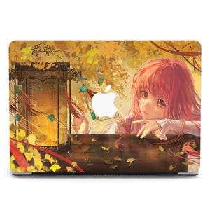 May include: A laptop skin with a colorful anime-style illustration of a girl with pink hair, looking out from behind a wooden railing. The background features a golden autumnal scene with leaves and a lantern.