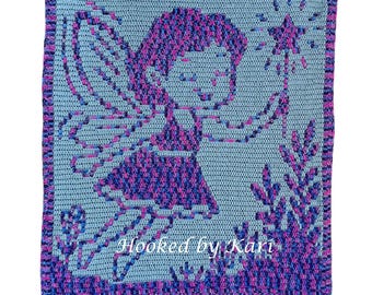 May include: A square, crocheted blanket featuring a fairy design. The fairy is depicted in shades of purple and pink against a light blue background. The blanket has a border and the text "Hooked by Kari".