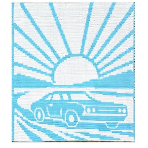 May include: A crocheted wall hanging featuring a retro car driving towards a rising sun. The design uses a pixelated style with a color palette of white and light blue. The car is a classic muscle car.