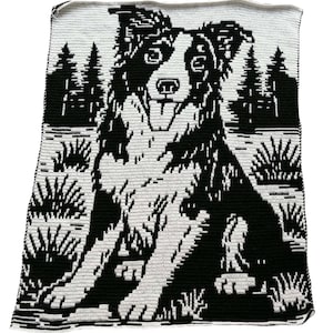 May include: A rectangular crochet blanket featuring a black and white graphic design of a dog sitting in a forest landscape. The dog is positioned in the center, surrounded by stylized pine trees and small bushes, all rendered in high-contrast yarn.