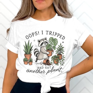 Oops I Tripped and Got Another Plant Shirt, Funny Plant Mom Tee, Raccoon Plant Lover Gift, Gardener Humor T-Shirt, Houseplant Collector