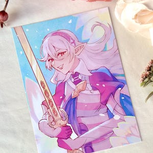 May include: A rectangular art print featuring a digital illustration of a light-haired elf-like character with pointed ears, wearing armor with pink and blue accents, holding a long golden sword against a bright blue and white background.