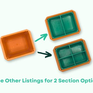 May include: Two orange plastic containers with lids. One container has a single compartment, while the other has two compartments. The containers are shown side-by-side with arrows pointing to each other. The text "See Other Listings for 2 Section Option" is at the bottom of the image.