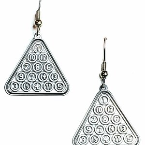 May include: A pair of silver earrings shaped like a triangle with the numbers 1 through 15 arranged in a pool ball rack pattern.