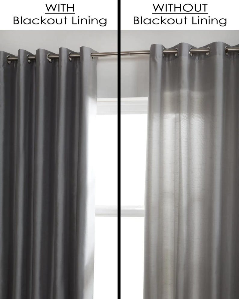 May include: Two identical curtains, one with a blackout lining and one without. The curtain with the blackout lining is dark gray and blocks out all light. The curtain without the blackout lining is light gray and allows light to shine through.
