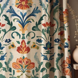 May include: Cream-coloured curtain panel with a repeating floral pattern. The design features stylised flowers in shades of orange, yellow, blue, and green. The curtain has a textured appearance, suggesting a linen or similar fabric.