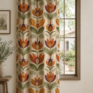 May include: A floor-length curtain hanging from a dark wooden rod, featuring a repeating vertical pattern of stylized orange, purple, and sage green flowers on a cream background, with small semi-circular arch motifs between the floral stems.