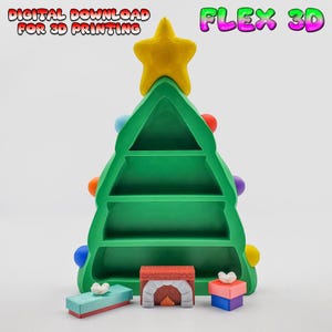 May include: A green Christmas tree-shaped shelf with a yellow star on top. The shelf has three levels and is decorated with colorful ornaments. Small, decorative items, including a fireplace and gift boxes, are at the base. The text "DIGITAL DOWNLOAD FOR 3D PRINTING" and "FLEX 3D" are visible.