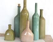 Still life of six bottle forms. Decor, sculpture, hand made, aqua, olive, pink, beach, modern, rustic.