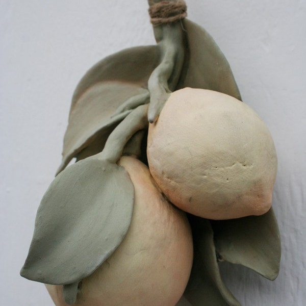 Sculpted ceramic branch with two lemons