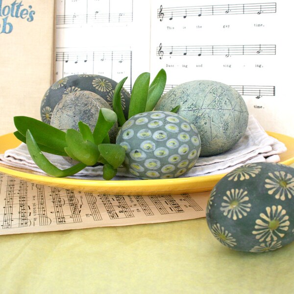 Group of five hand painted ceramic spheres with daisies and dots. 45