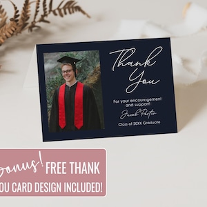 May include: A navy blue graduation thank you card with a photo of a graduate in a cap and gown with red stoles. The card features the words "Thank You" in elegant script, along with the graduate's name and class year. A bonus free thank you card design is included.