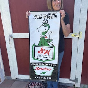 May include: A rustic wooden sign with the text "Welcome to our home" in white lettering. The sign features a distressed finish and a simple, inviting design, perfect for a front porch or entryway.