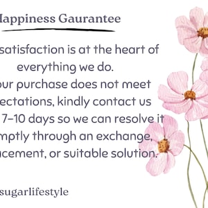 May include: A white background with text stating a "Happiness Guarantee" and a satisfaction promise. Watercolor pink cosmos flowers are in the upper right. The text is in a simple, readable font.