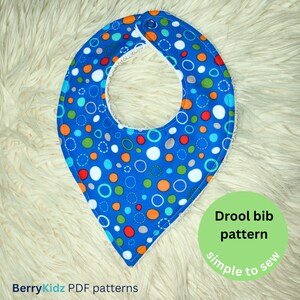 May include: A blue and white drool bib with a colourful circle pattern. The bib is made of soft fabric and has a simple design. The text "Drool bib pattern simple to sew" is written on a green circle.