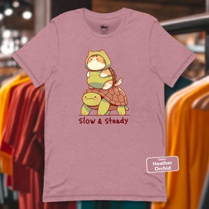 Slow and Steady T-Shirt, Kawaii Cat in Turtle Costume Tee, Cute Cartoon Cat Riding Turtle, Adorable Animal Graphic Shirt, Funny Feline Tee