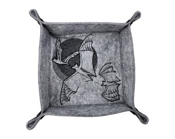May include: Gray felt tray with a stitched border and a bat design. The interior features a black and white illustration of bats flying in front of a moon. The tray has a square shape with rounded corners and a folded edge.