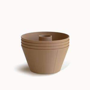 May include: A stack of four tan-coloured, cone-shaped bowls with a central, cylindrical insert. The bowls have a smooth exterior and a slightly textured interior. The design is minimalist and modern, suitable for kitchen or dining use.
