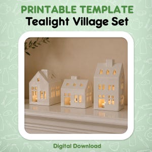 Peut inclure: Un ensemble de trois photophores en céramique blanche en forme de maison avec des fenêtres et des cheminées découpées. Le texte PRINTABLE TEMPLATE Tealight Village Set et Digital Download apparaît sur le fond vert clair entourant l'image.