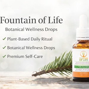 May include: An amber glass bottle of "Fountain of Life" botanical wellness drops with a white dropper. The label includes text and a green and orange design. A sprig of evergreen is in the foreground. The text reads "Plant-Based Daily Ritual".