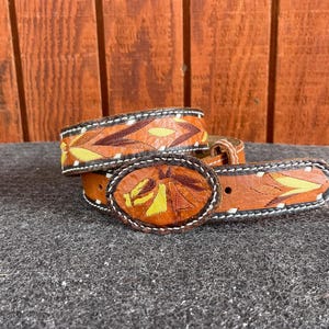 Child size embroidered western leather belt w leather buckle.