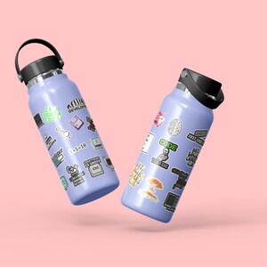 May include: Two purple water bottles with black lids and handles. The bottles are covered in stickers with a coding theme, including text like "I'm a Software Developer", "Code", and "Ctrl+Alt+Delete".