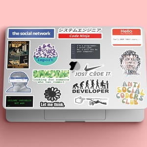 May include: A laptop computer with various stickers, including "the social network", "Code Ninja", "JUST CODE IT", "DEVELOPER", "ANTI SOCIAL CODERS CLUB", and "Let me think."