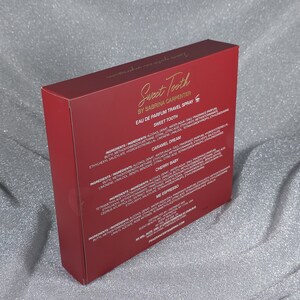 May include: A red box of Sweet Tooth by Sabrina Carpenter Eau de Parfum Travel Spray. The box features the product name and fragrance names: Sweet Tooth, Caramel Dream, Cherry Baby, and Me Espresso.