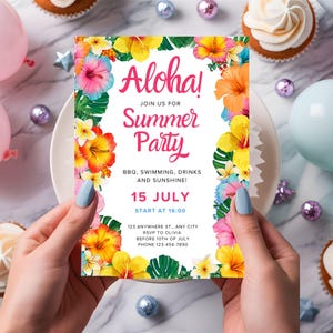 May include: A colorful invitation with the text "Aloha! Summer Party" surrounded by tropical flowers. The invitation includes details for a summer party, such as the date, time, and RSVP information. The invitation is held by a person.