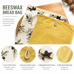 May include: A beeswax bread bag featuring an off-white exterior with a green olive branch pattern and a solid yellow interior lining. The bag includes an adjustable black buckle closure and a small hanging loop. Text on the image reads BEESWAX BREAD BAG.