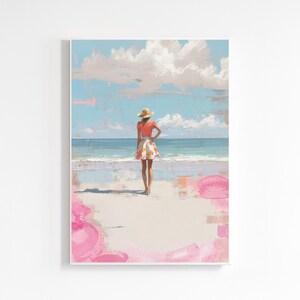 以下が含まれることがあります： 海を眺めるビーチに立つ人物のアートプリント。人物は麦わら帽子、オレンジ色のトップス、花柄のスカートを着用しています。空は青く白い雲があり、ビーチにはピンク色のアクセントがあります。このアートワークは、夏とレジャーの感覚を呼び起こします。