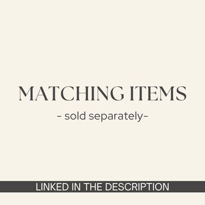 May include: Text on a cream-colored background reads "MATCHING ITEMS - sold separately-". Below, a dark gray banner displays the text "LINKED IN THE DESCRIPTION". The text is in a serif font.