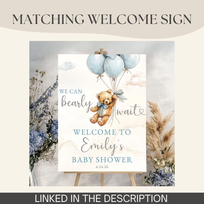 May include: A baby shower welcome sign featuring a watercolor illustration of a teddy bear holding blue balloons. The sign reads "We can bearly wait" and welcomes guests to Emily's baby shower on April 14, 2026. The sign is linked in the description.