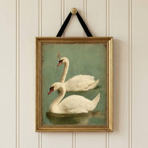 Soft animal artwork set in blush tones displayed as nursery wall decor above crib with delicate floral watercolor style