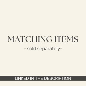 May include: Text on a cream-colored background reads "MATCHING ITEMS - sold separately-" in a dark serif font. Below, a dark gray banner states "LINKED IN THE DESCRIPTION".